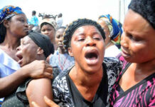 Tragic Loss: Father, Four Children, and 98 Other Wedding Guests Die in Boat Mishap Nigerian woman crying , tears