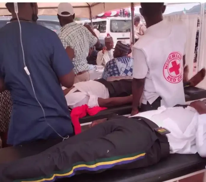 Two policemen slump during inauguration parade in Taraba