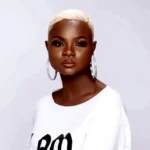 biography of Naomi Mac, including her age, music career, husband, child, songs, net worth, and Instagram handle