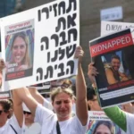 Protesters hold placards and portraits of Israeli hostages held by Hamas militants during a demonstration calling for their release in Tel Aviv on October 26, 2023. More than 200 people are thought to have been kidnapped by Hamas. GETTY