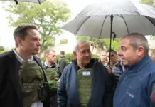 Anti-Semitism: Elon Musk visits Israel, backs war against Hamas US billionaire Elon Musk, left, and Prime Minister Benjamin Netanyahu, center, take a tour of Kfar Aza, November 27, 2023. Photo Credit: Amos Ben Gershom/GPO)