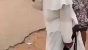 Viral Video Unfolds as Catholic Priest Holds Gun Amid Terror Attacks in Plateau