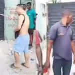 Chinese National Caught Tearing Naira Notes in Lagos, Sparks Outrage
