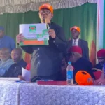 Photo of Peter Obi holding ADC membership card