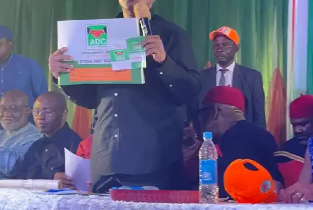 Photo of Peter Obi holding ADC membership card