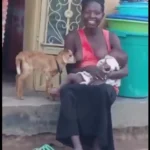 Woman Nursing Baby and Goat